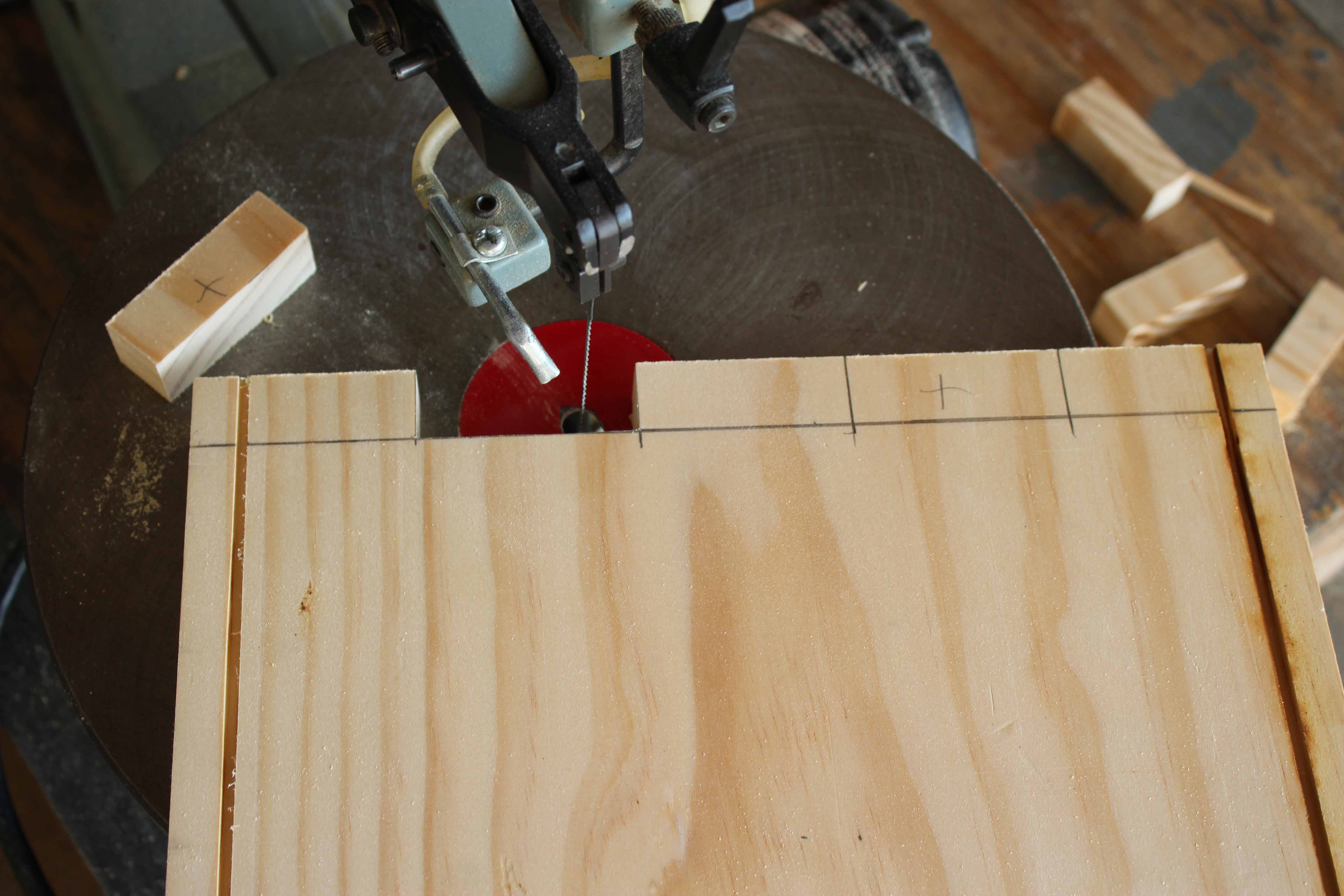 Using a scroll saw to create box joints in manufacturing an ATX power supply